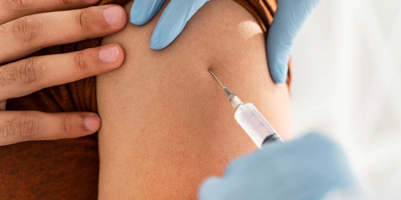 close-up-man-being-vaccinating-by-doctor